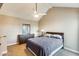 Well lit bedroom with ceiling fan and dresser at 3716 E University Dr # 2014, Mesa, AZ 85205