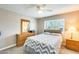 Bedroom with queen bed, dresser, and ceiling fan at 3716 E University Dr # 2014, Mesa, AZ 85205