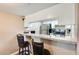 Granite countertop kitchen with breakfast bar and stainless steel appliances at 3716 E University Dr # 2014, Mesa, AZ 85205