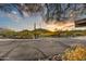 Asphalt driveway with desert landscape and mountain views at 37801 N Cave Creek Rd # 13, Cave Creek, AZ 85331