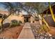 Landscaped front yard with walkway leading to home entrance at 37801 N Cave Creek Rd # 13, Cave Creek, AZ 85331