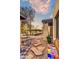 Stone patio with colorful tile bench and desert plants at 37801 N Cave Creek Rd # 13, Cave Creek, AZ 85331