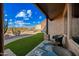 Relaxing covered porch with wicker chairs and a view of the desert landscape at 5581 E Superstition Blvd, Apache Junction, AZ 85119