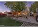 Relaxing backyard oasis with a pergola, patio, and artificial turf at 7619 W Tonto Dr, Glendale, AZ 85308