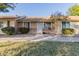 Front view of a charming single-story home with well-maintained landscaping at 8907 W Desert Jewel Dr, Peoria, AZ 85345