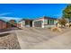 Single-story home with a two-car garage and desert landscaping at 926 W Ayrshire Trl, San Tan Valley, AZ 85143