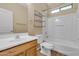 Bathroom with wood vanity, toilet, and bathtub at 1087 E Nickleback St, San Tan Valley, AZ 85143