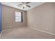 Bright bedroom with neutral walls, ceiling fan, and carpeting at 1087 E Nickleback St, San Tan Valley, AZ 85143