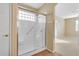 Bathroom with a large shower stall, glass enclosure, and tiled floor at 1087 E Nickleback St, San Tan Valley, AZ 85143