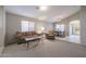 Living room featuring a brown couch, coffee table, and a TV at 15535 N 159Th Ln, Surprise, AZ 85374