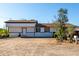 House exterior showcasing a white facade and a spacious front yard at 17428 N 27Th St, Phoenix, AZ 85032