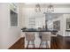 Modern bar with a sleek black countertop and white cabinetry at 18884 N 98Th St, Scottsdale, AZ 85255