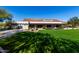 Spanish-style community clubhouse with lawn and patio at 18884 N 98Th St, Scottsdale, AZ 85255