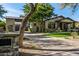 House exterior with a landscaped lawn and driveway at 18884 N 98Th St, Scottsdale, AZ 85255