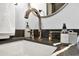 Elegant bathroom featuring a contemporary sink and rose gold faucet at 2013 N 66Th St, Scottsdale, AZ 85257