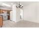 Kitchen features wood cabinets, white appliances, and tile floor at 21067 N Sequoia Crest N Dr, Surprise, AZ 85387