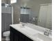 Bathroom with double vanity, shower, and gray towels at 2150 W Alameda Rd # 2139, Phoenix, AZ 85085