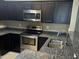 Modern kitchen with stainless steel appliances and granite countertops at 2150 W Alameda Rd # 2139, Phoenix, AZ 85085