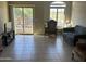Living room with tiled floors, sliding glass door, and comfortable seating at 2150 W Alameda Rd # 2139, Phoenix, AZ 85085