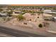 Aerial view of a single-story house with a circular driveway, and desert landscape at 2221 E Joy Ranch Rd, Phoenix, AZ 85086