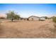 Large backyard with gravel ground cover and mature desert landscaping at 2221 E Joy Ranch Rd, Phoenix, AZ 85086