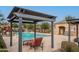 Inviting community pool with lounge chairs and shaded seating areas at 3114 S Sunrise Ave, Mesa, AZ 85212