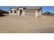 Newly built home with a two-car garage and gravel driveway at 34838 N 3Rd Ave, Phoenix, AZ 85086