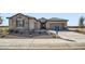 Single-story home with stone accents, two-car garage, and landscaping at 3753 E Terrel St, San Tan Valley, AZ 85143