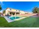 Stunning two-story home featuring a sparkling pool in the backyard at 40887 W Chambers Dr, Maricopa, AZ 85138