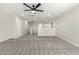 Bright and airy loft area with carpeted flooring at 40887 W Chambers Dr, Maricopa, AZ 85138