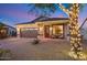 Charming house exterior with festive lights and landscaping at 4216 E Oxford Ln, Gilbert, AZ 85295