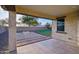 Covered patio overlooks grassy backyard with fire pit at 4360 N 186Th Ln, Goodyear, AZ 85395