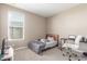 Bedroom with a bed, desk, and built-in closet at 4462 W Ian Dr, Laveen, AZ 85339