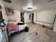 Main bedroom with a large bed and projection screen at 451 N 68Th Ln # 168, Phoenix, AZ 85043