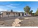 Large backyard with gravel and a stone pathway at 5232 E Dodge St, Mesa, AZ 85205