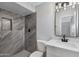 Spa-like bathroom with grey tile shower and modern fixtures at 5232 E Dodge St, Mesa, AZ 85205