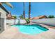 Inviting kidney-shaped pool with surrounding patio at 5679 E Beverly Ln, Scottsdale, AZ 85254