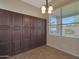 Breakfast nook with built-in cabinetry and window overlooking backyard at 6520 W Oraibi Dr, Glendale, AZ 85308