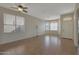 Living room with tile floors and large windows, offering natural light at 6520 W Oraibi Dr, Glendale, AZ 85308