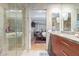 Modern bathroom with double vanity and a view of the bedroom at 7141 E Rancho Vista Dr # 4009, Scottsdale, AZ 85251