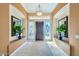 Bright entryway with tiled floors and stained glass at 8336 E Sunnyside Dr, Scottsdale, AZ 85260