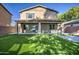 Two-story home with covered patio and artificial turf at 931 E Harrison St, Chandler, AZ 85225