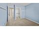 Bedroom with light blue walls, carpet, and a large closet at 931 E Harrison St, Chandler, AZ 85225