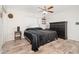 Main bedroom with a king-size bed, dresser, and ceiling fan at 10034 N 37Th Ave, Phoenix, AZ 85051