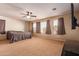 Spacious bedroom with large windows, carpet, and ceiling fan at 12006 W Vernon Ave, Avondale, AZ 85392