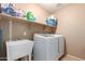 Laundry room with washer, dryer, and utility sink at 12006 W Vernon Ave, Avondale, AZ 85392
