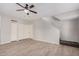 Bright living room with laminate flooring, ceiling fan, and ample closet space at 1245 W 1St St # 114, Tempe, AZ 85281