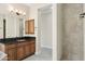 Bathroom with a single vanity, dark countertop, and shower at 12860 W Calle De Sol --, Peoria, AZ 85383