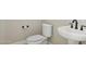 Clean bathroom with toilet and pedestal sink at 12860 W Calle De Sol --, Peoria, AZ 85383