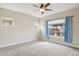 Relaxing bedroom with carpet flooring and a view to the backyard at 12860 W Calle De Sol --, Peoria, AZ 85383